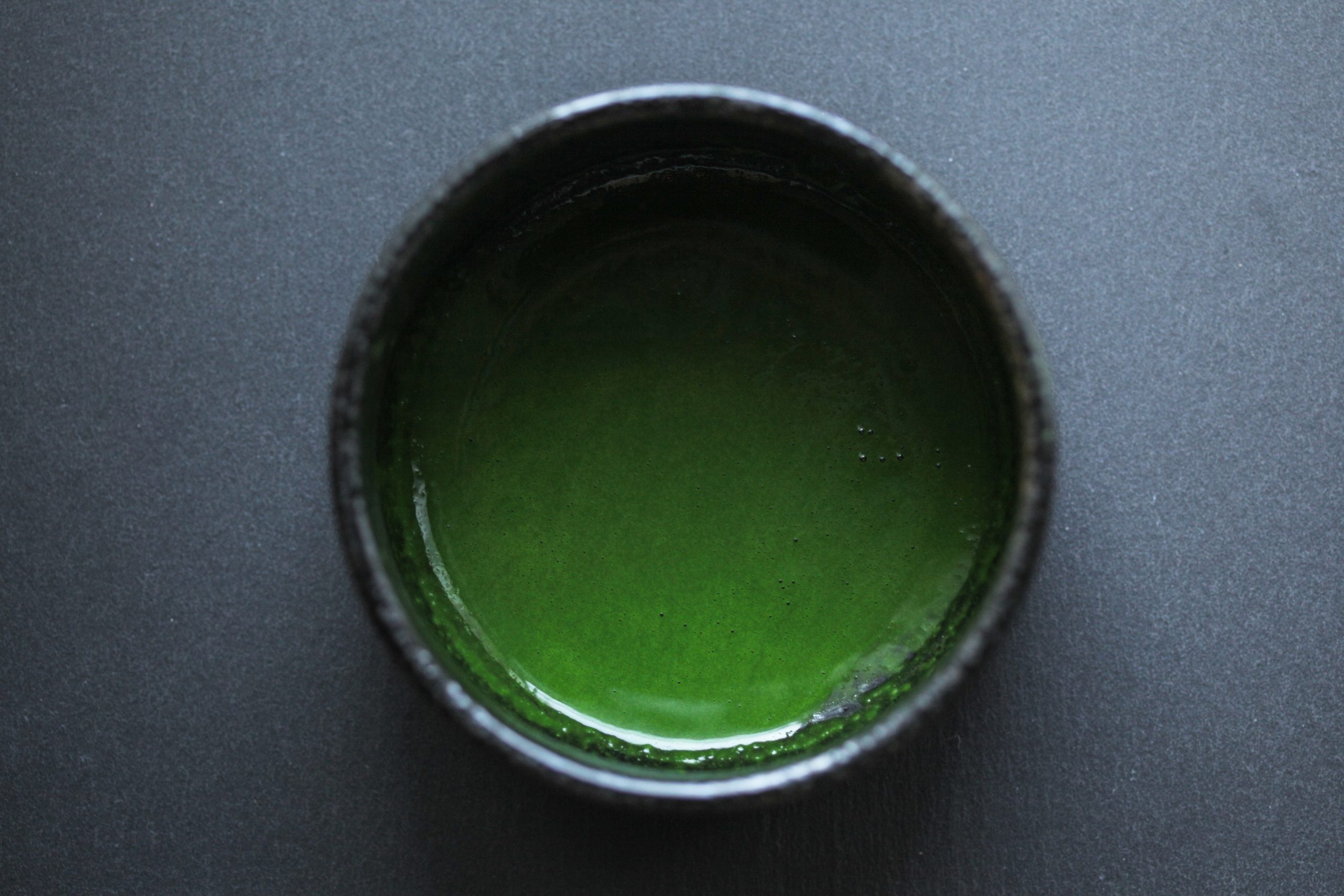 Koicha (thick tea) matcha brewed inside chawan.